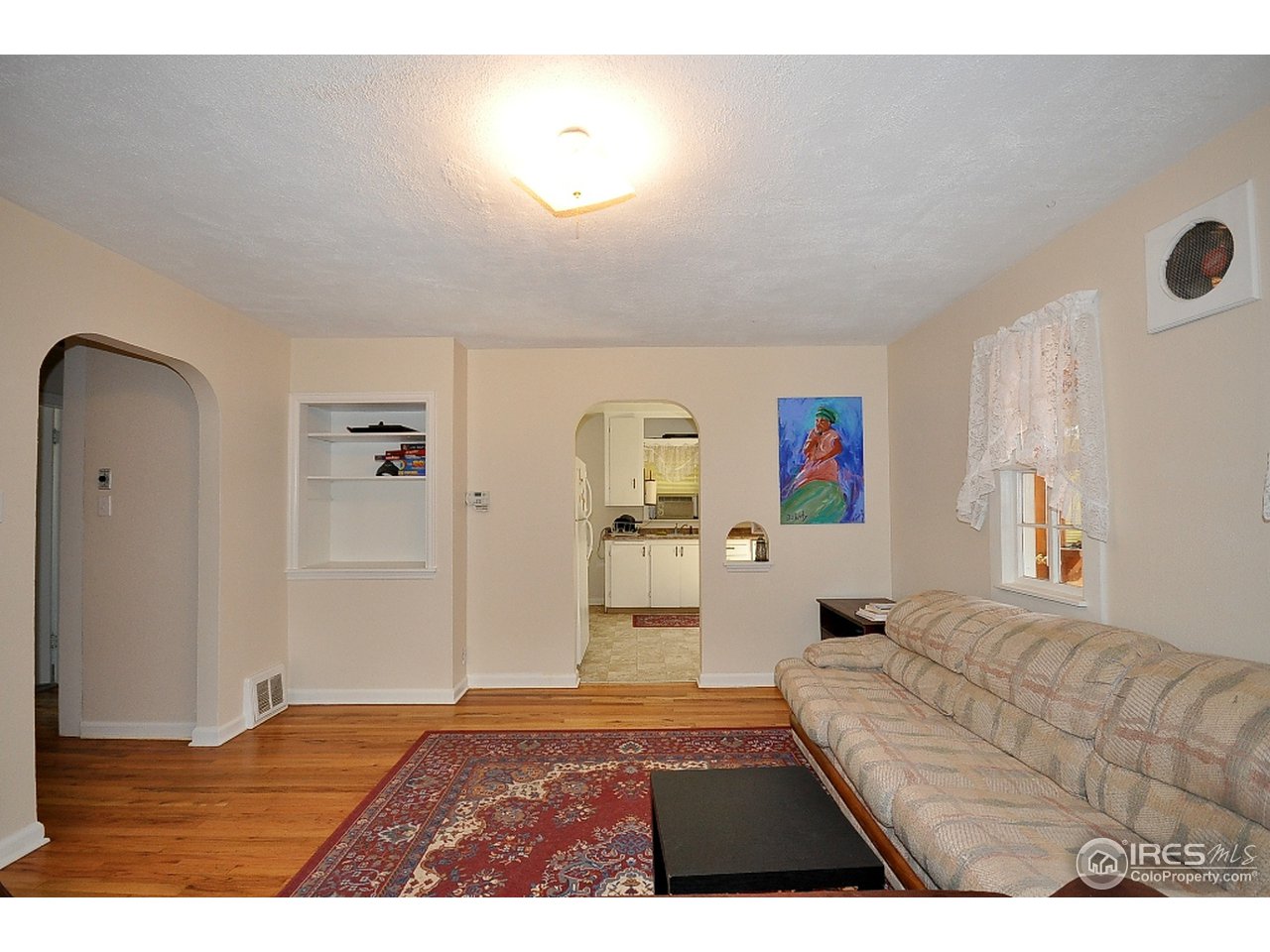 222 North Whitcomb Street Fort Collins, CO 80521 - Photo 4 of 23 a living room with furniture and a window