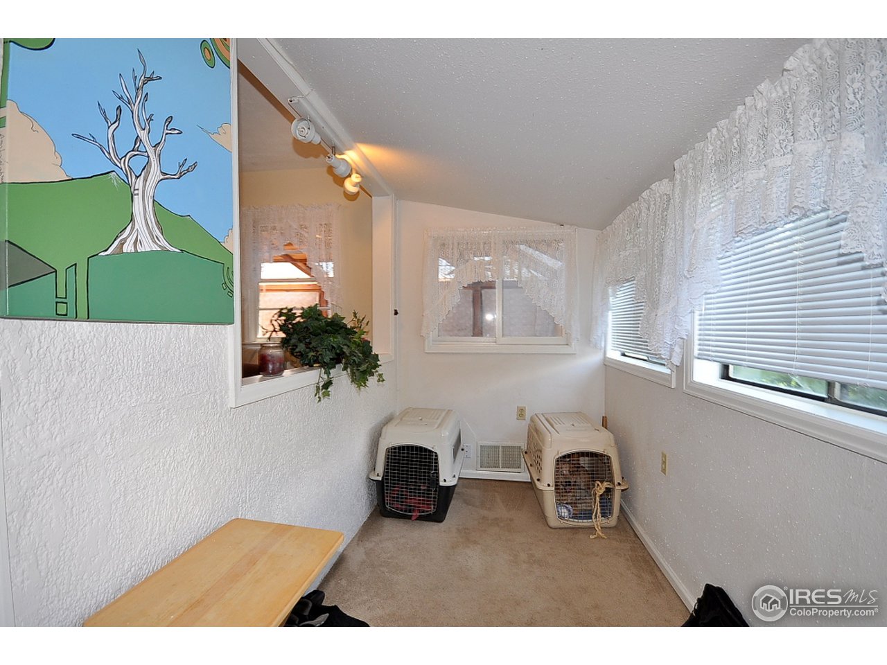 222 North Whitcomb Street Fort Collins, CO 80521 - Photo 6 of 23 a living room with furniture and a window
