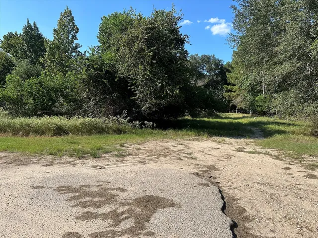 a view of a lake with a yard