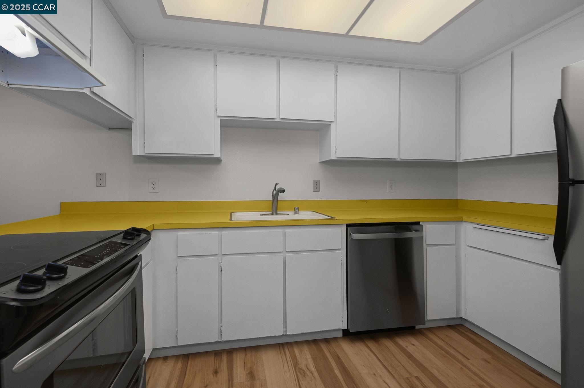 412 Carillo Court San Ramon, CA 94583 - Photo 12 of 28 a kitchen with a sink and cabinets