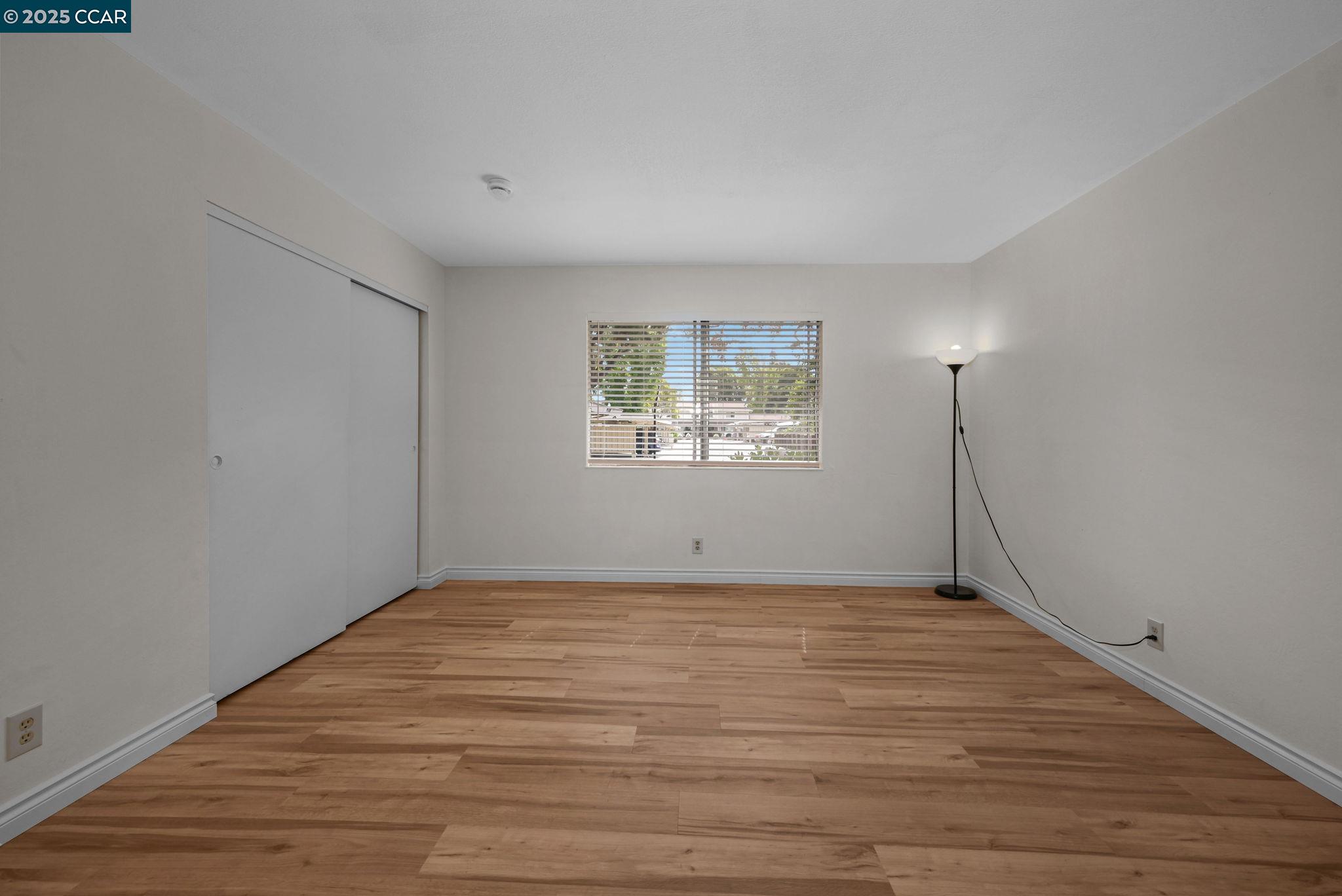412 Carillo Court San Ramon, CA 94583 - Photo 15 of 28 a view of an empty room with wooden floor and a window