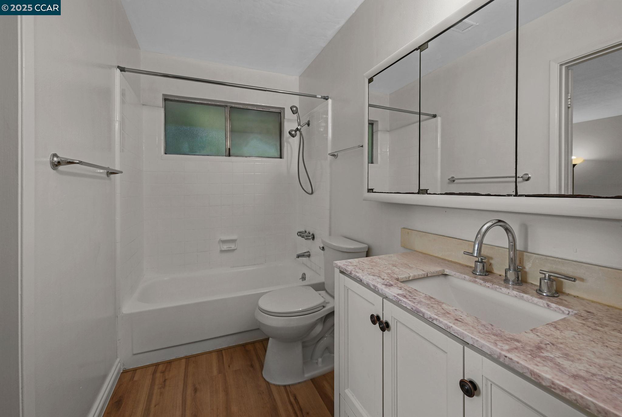 412 Carillo Court San Ramon, CA 94583 - Photo 16 of 28 a bathroom with a granite countertop sink toilet and shower