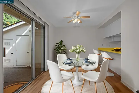 a dining room with furniture and chandelier