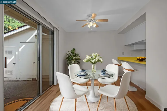 a dining room with furniture and chandelier