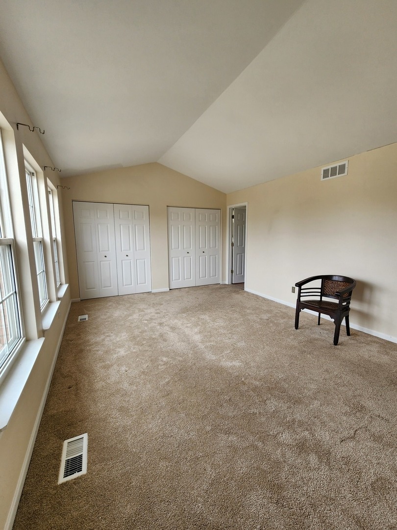 7309 Atkinson Circle Plainfield, IL 60586 - Photo 16 of 38 a view of an empty room with a window