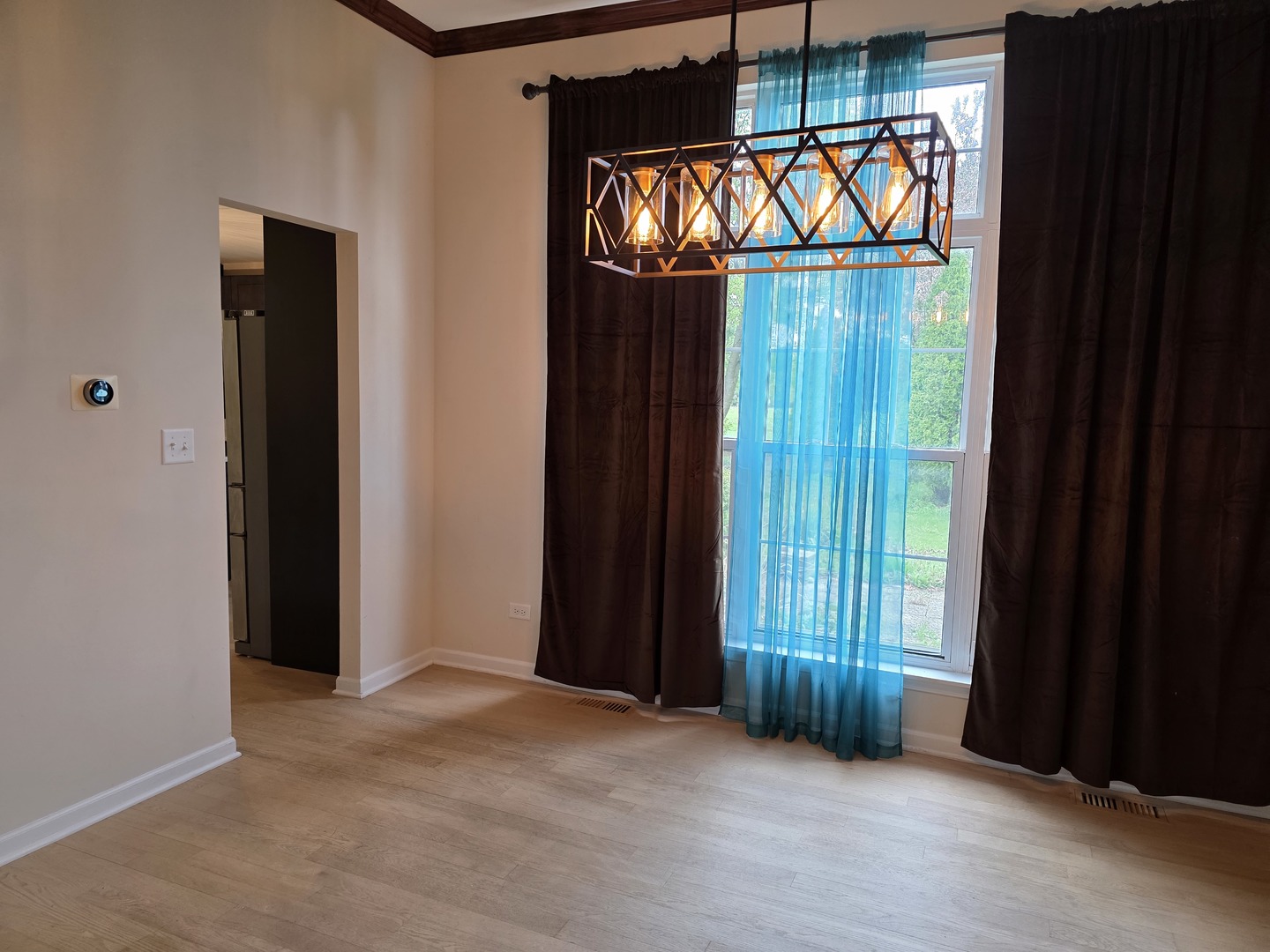 7309 Atkinson Circle Plainfield, IL 60586 - Photo 23 of 38 an empty room with large windows and a balcony