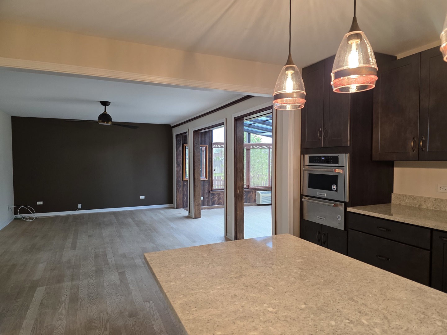 7309 Atkinson Circle Plainfield, IL 60586 - Photo 25 of 38 a kitchen with cabinets and wooden floor