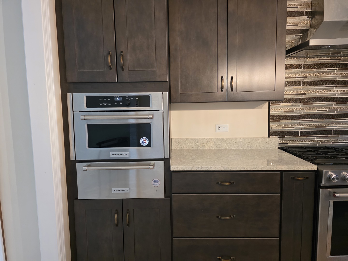7309 Atkinson Circle Plainfield, IL 60586 - Photo 27 of 38 a kitchen with granite countertop stainless steel appliances and wooden cabinets