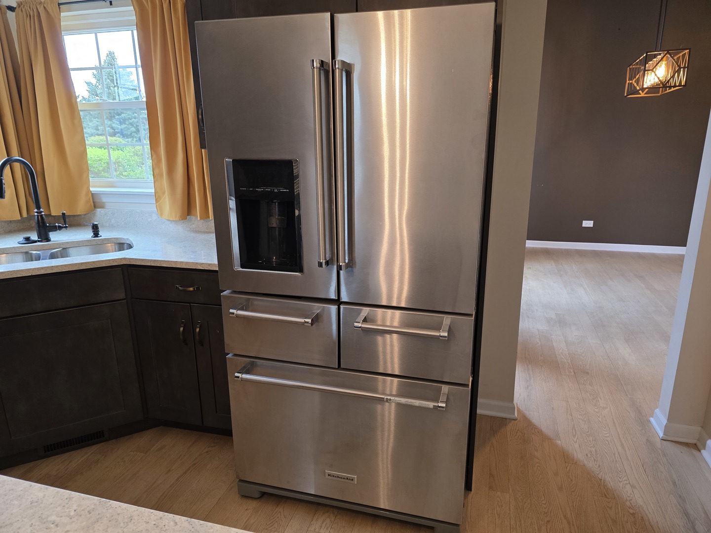 7309 Atkinson Circle Plainfield, IL 60586 - Photo 29 of 38 a kitchen with a refrigerator and a sink