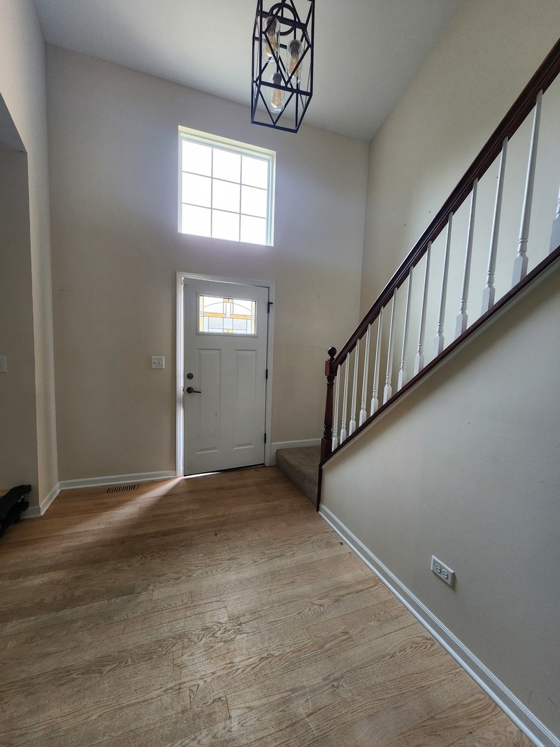7309 Atkinson Circle Plainfield, IL 60586 - Photo 9 of 38 a view of an empty room with window