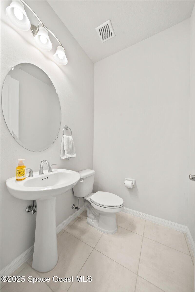 3245 Hummingbird Way Melbourne, FL 32940 - Photo 11 of 66 Downstairs 1/2 bath