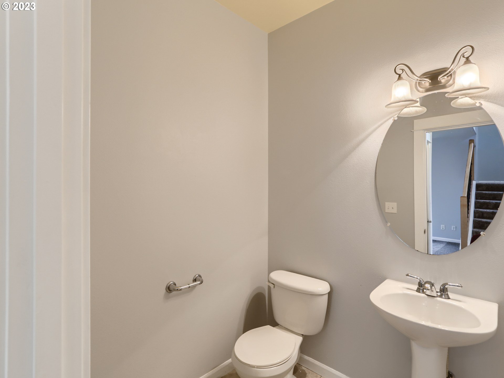 14505 Southeast Clatsop Street Portland, OR 97236 - Photo 13 of 27 a bathroom with a toilet sink and mirror