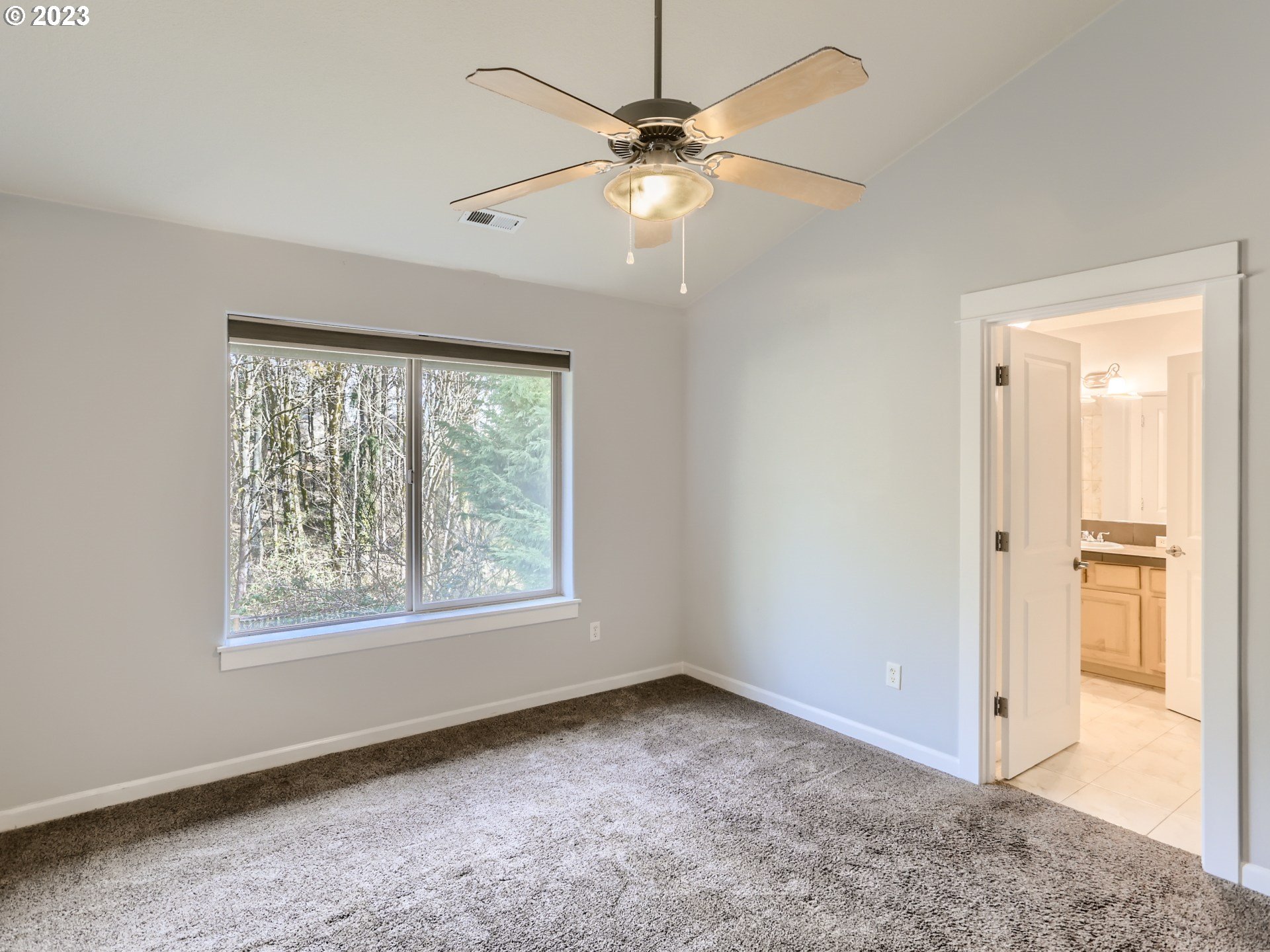 14505 Southeast Clatsop Street Portland, OR 97236 - Photo 15 of 27 a view of an empty room with a window