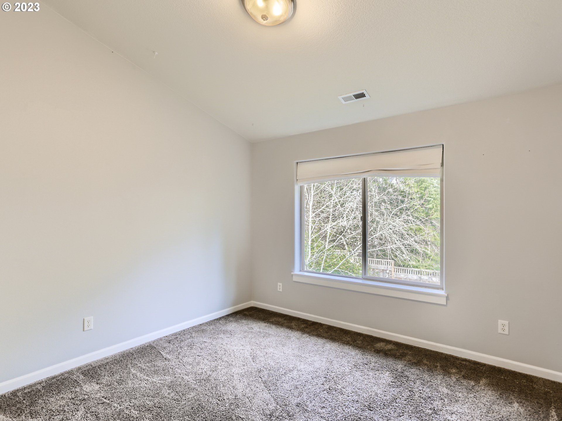 14505 Southeast Clatsop Street Portland, OR 97236 - Photo 19 of 27 an empty room with a window