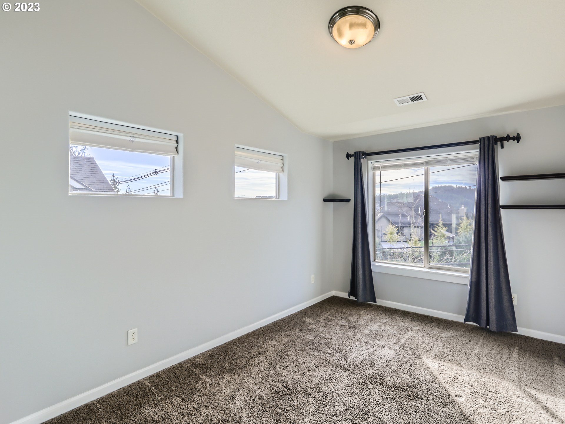 14505 Southeast Clatsop Street Portland, OR 97236 - Photo 21 of 27 a view of an empty room with a window