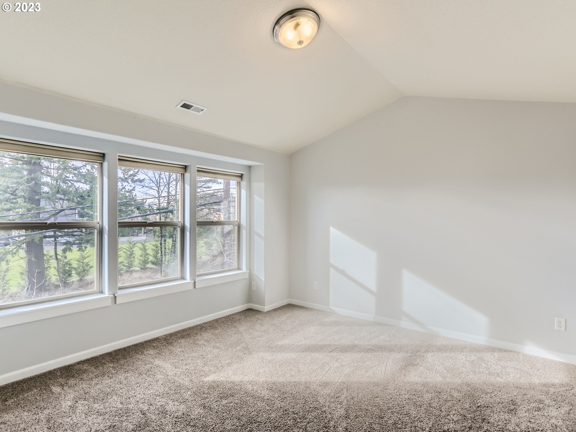 14505 Southeast Clatsop Street Portland, OR 97236 - Photo 23 of 27 an empty room with windows