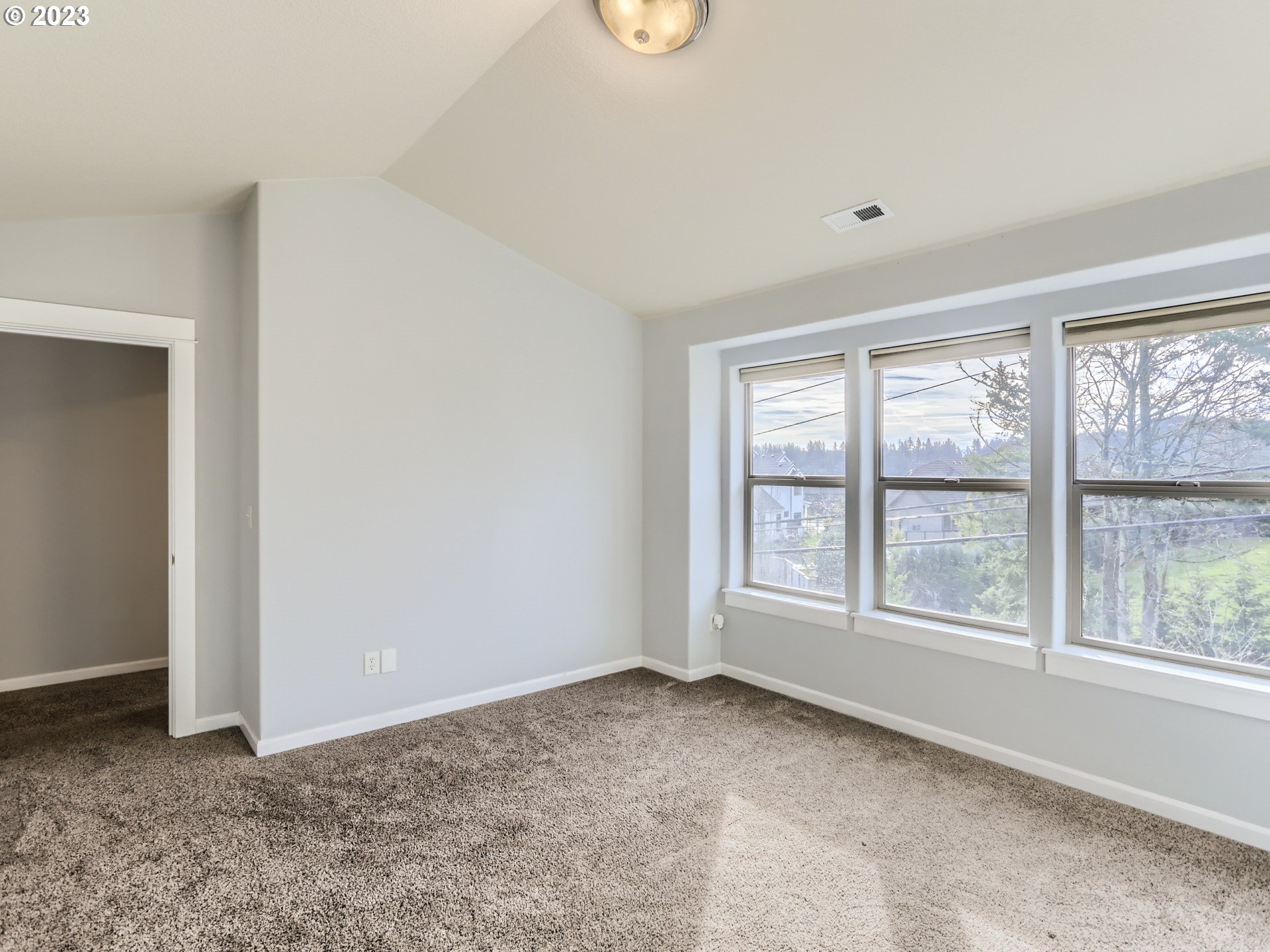 14505 Southeast Clatsop Street Portland, OR 97236 - Photo 24 of 27 a view of an empty room with a window