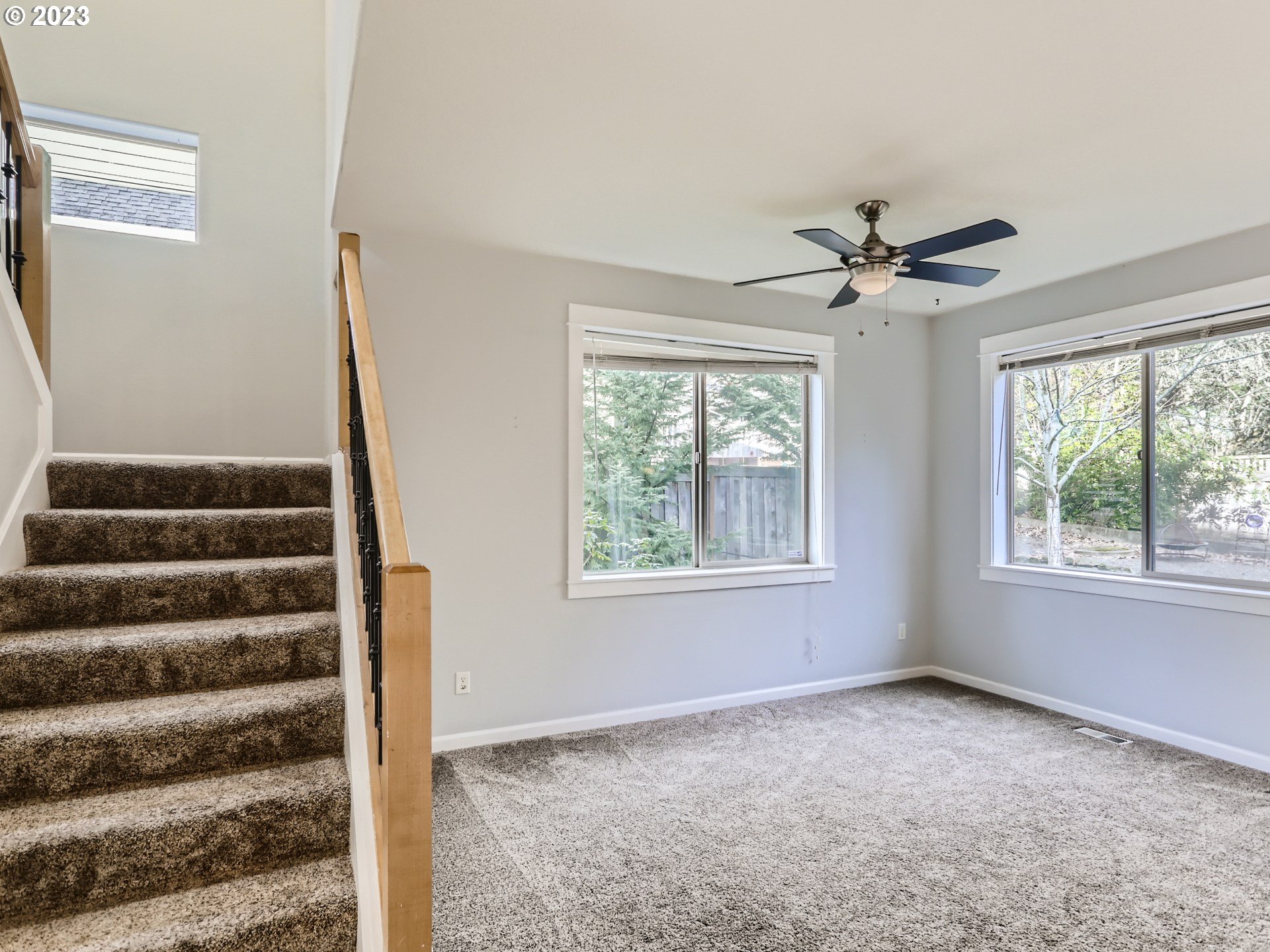 14505 Southeast Clatsop Street Portland, OR 97236 - Photo 5 of 27 a view of a livingroom with a ceiling fan and window