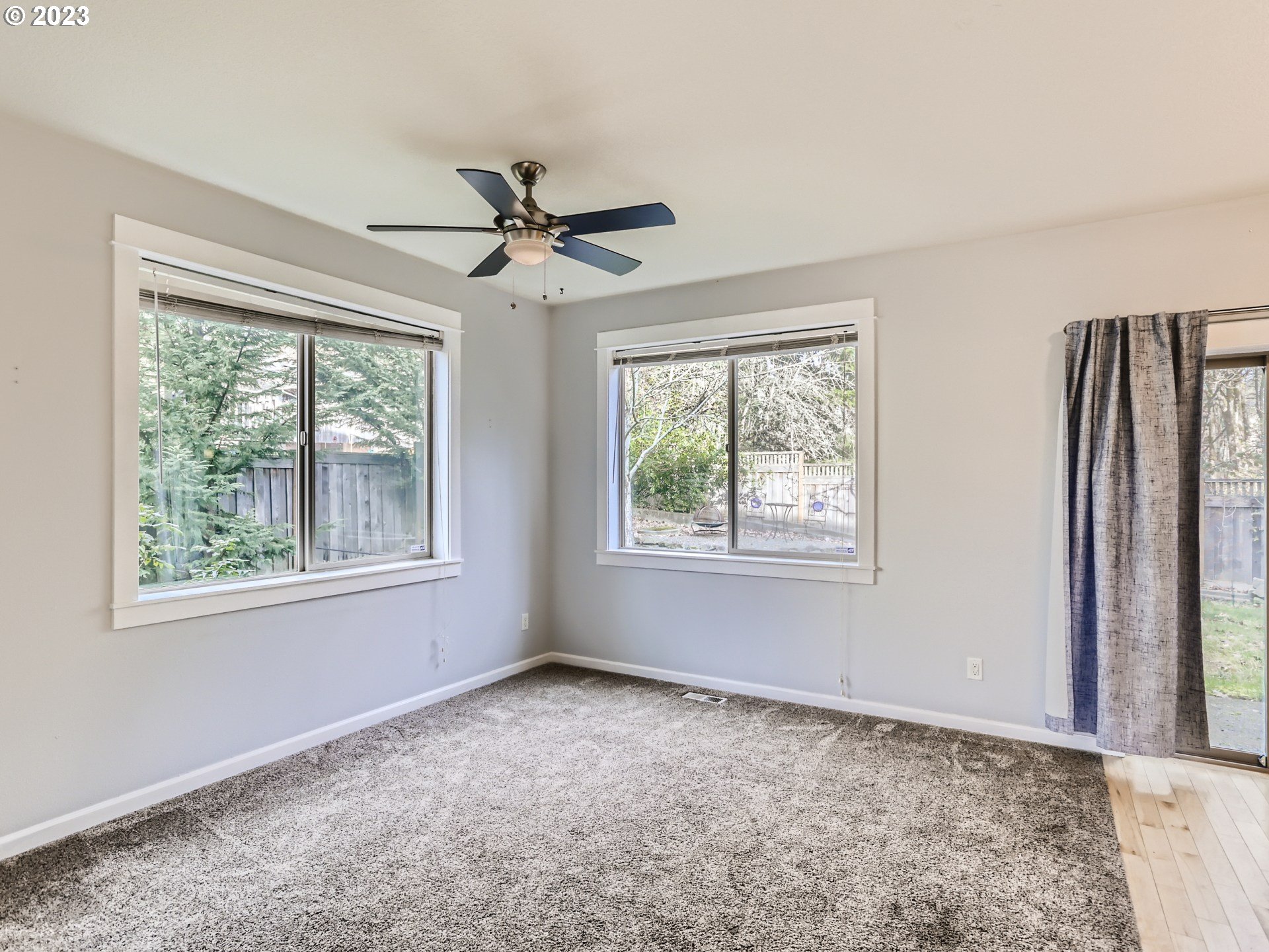 14505 Southeast Clatsop Street Portland, OR 97236 - Photo 6 of 27 a big room with windows and closet