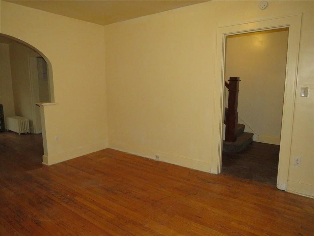 423 Braddock Road Pittsburgh, PA 15221 - Photo 6 of 36 a view of a room with wooden floor and bathroom