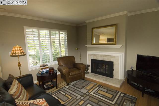 826 Podva Road, Unit B Danville, CA 94526 - Photo 1 of 1 a living room with furniture a flat screen tv and a fireplace