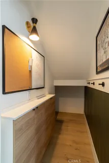 a view of room with window and wooden floor