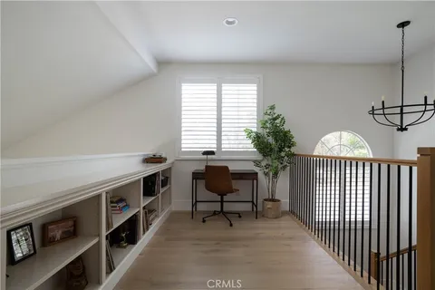 a view of a livingroom with furniture and staircase