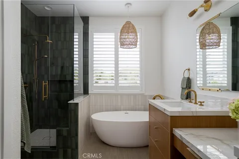 a bathroom with a tub sink and window