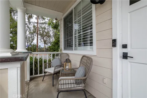 a view of balcony with furniture