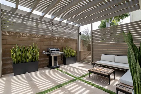 a outdoor living space with patio furniture and a potted plant