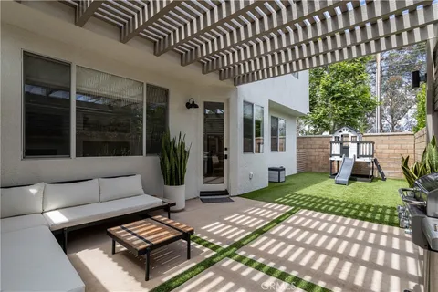 a backyard of a house with seating space