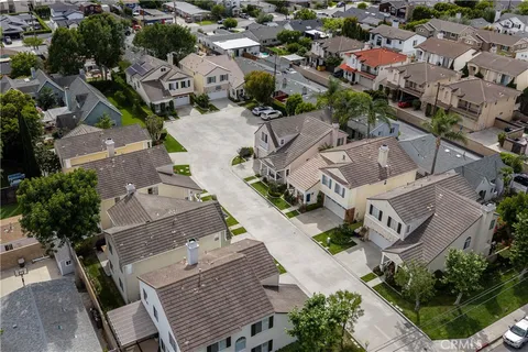 an aerial view of multiple houses with yard