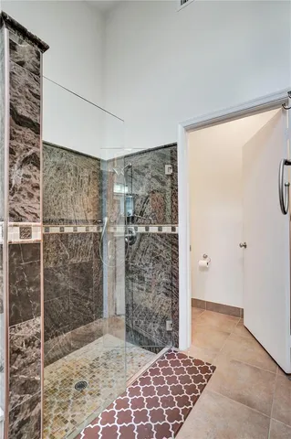 a large kitchen with stainless steel appliances wooden cabinets and a sink