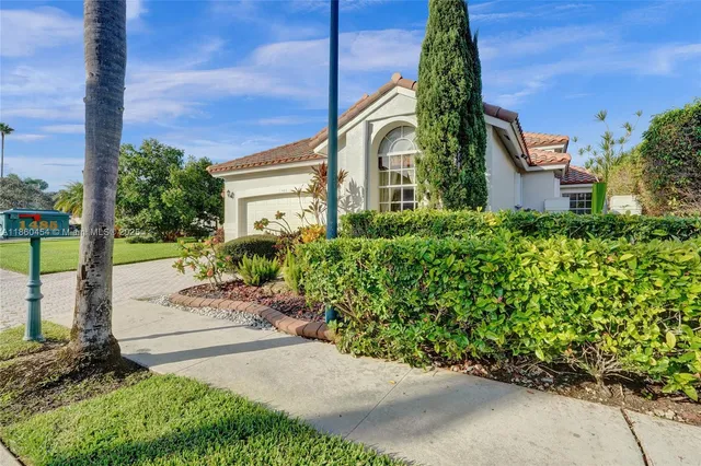 a backyard of a house with lots of green space