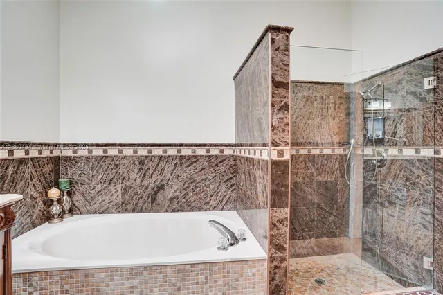 a kitchen with stainless steel appliances a refrigerator and microwave