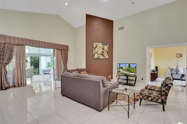 a kitchen with stainless steel appliances granite countertop a refrigerator stove top oven and sink