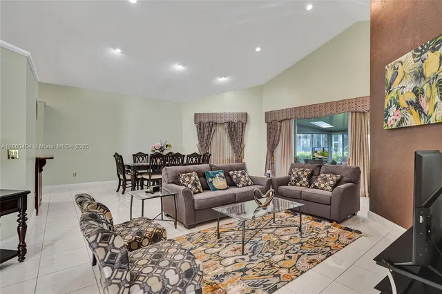 a living room with furniture and a table