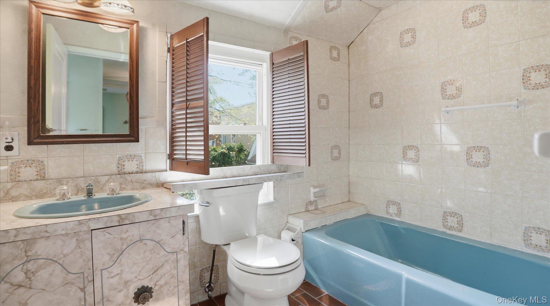 641 158th Street Queens, NY 11357 - Photo 15 of 37 a bathroom with a sink and toilet