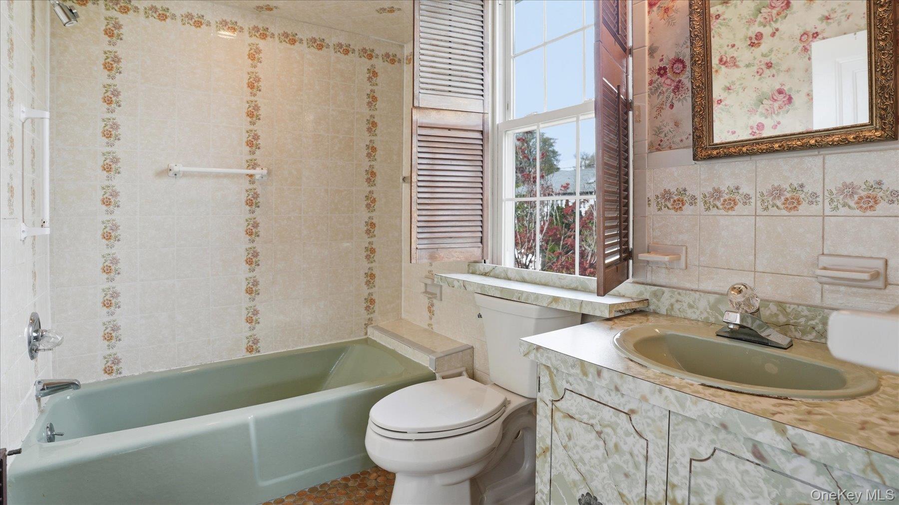 641 158th Street Queens, NY 11357 - Photo 16 of 37 a bathroom with a sink toilet and shower