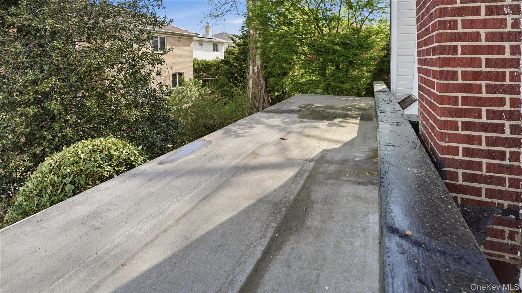641 158th Street Queens, NY 11357 - Photo 17 of 37 a view of a pathway both side of house
