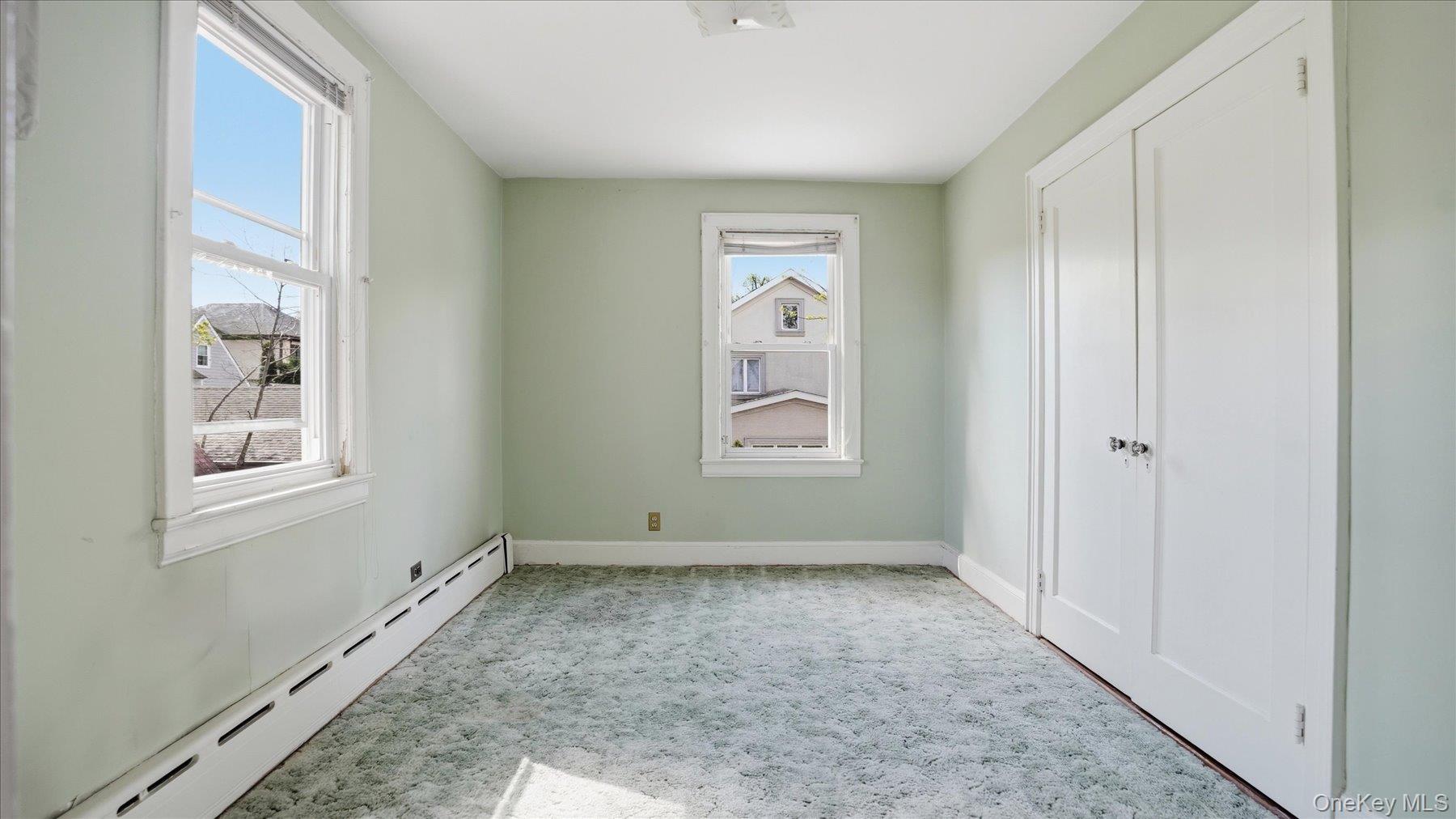 641 158th Street Queens, NY 11357 - Photo 19 of 37 an empty room with windows