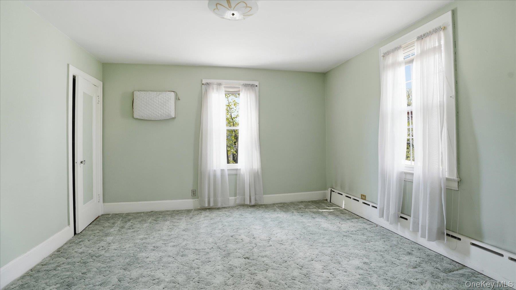 641 158th Street Queens, NY 11357 - Photo 21 of 37 an empty room with windows