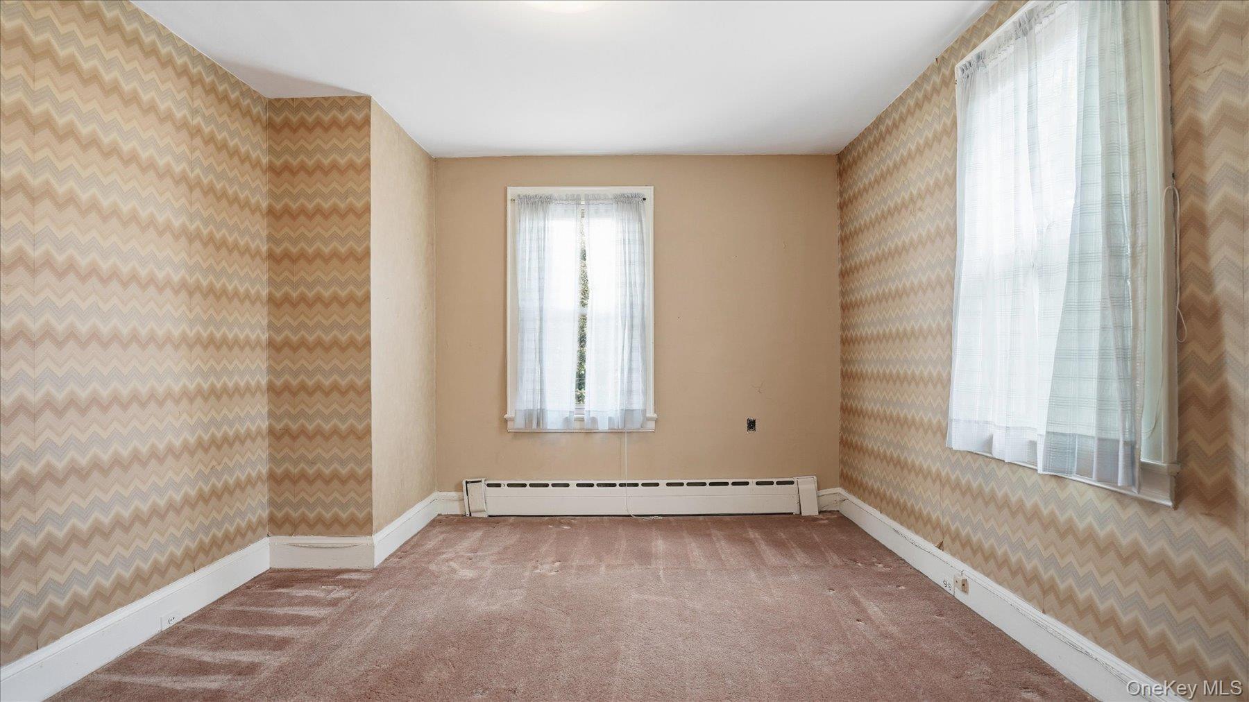 641 158th Street Queens, NY 11357 - Photo 22 of 37 an empty room with windows