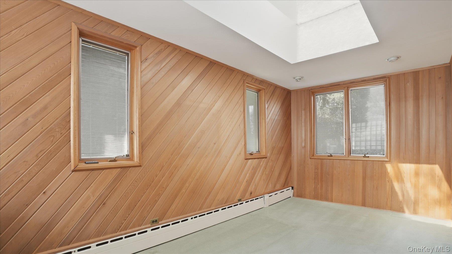 641 158th Street Queens, NY 11357 - Photo 6 of 37 an empty room with windows