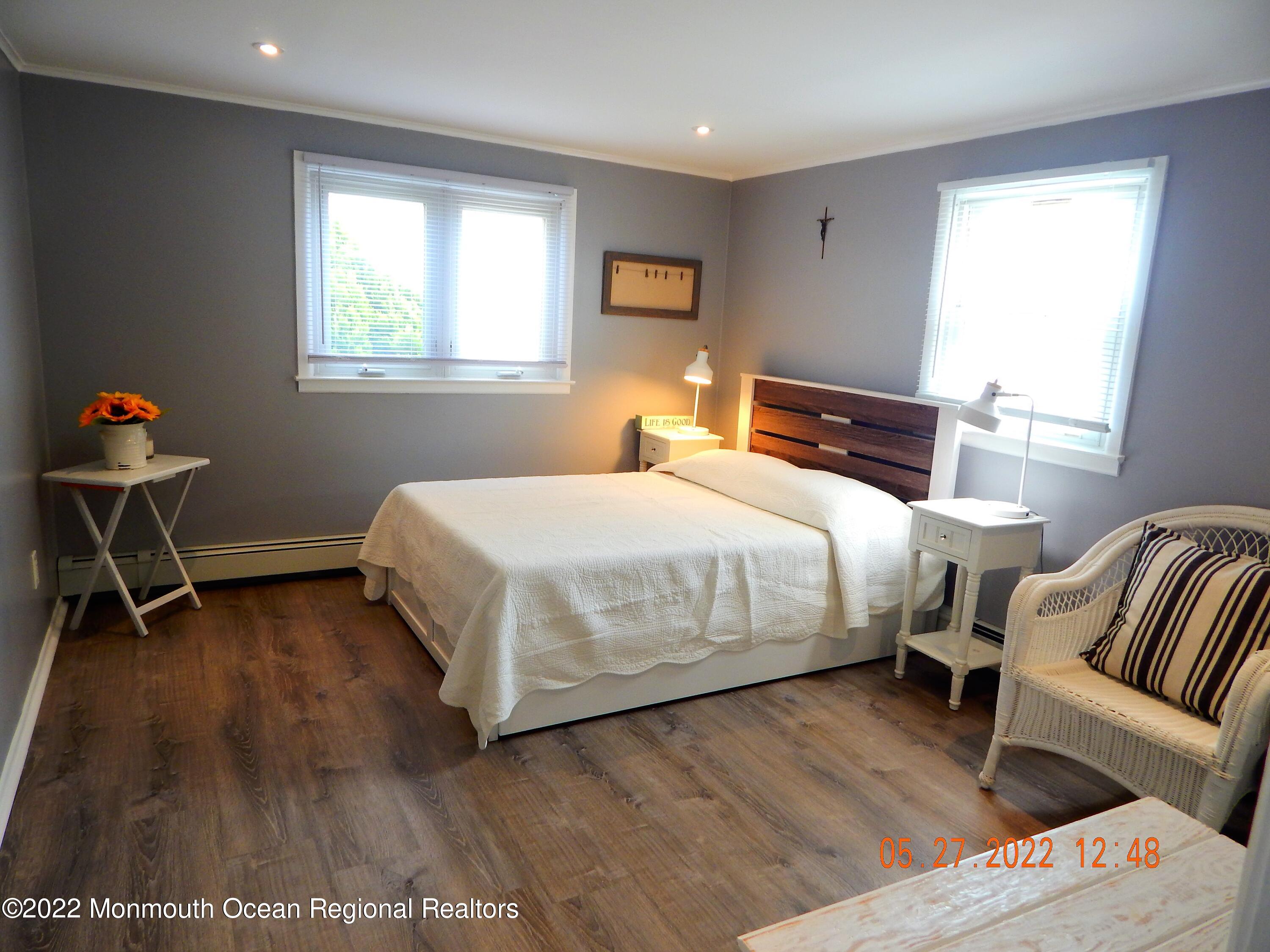 27 Club House Road Brick, NJ 08723 - Photo 17 of 31 a bedroom with a bed and wooden floor
