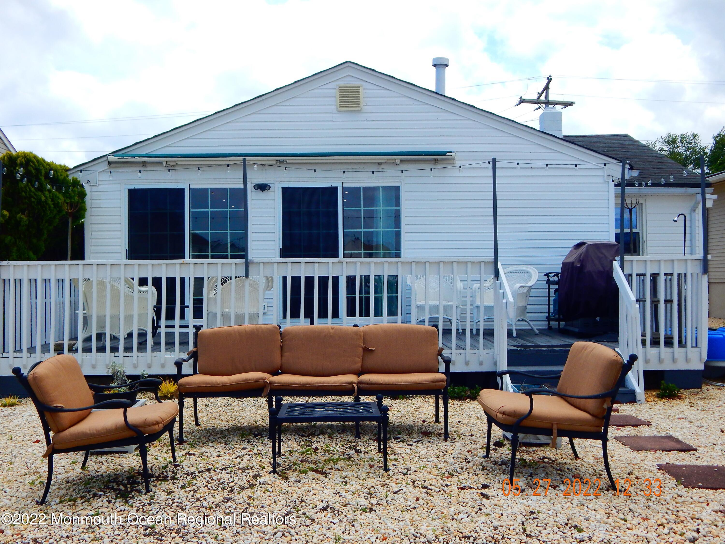27 Club House Road Brick, NJ 08723 - Photo 23 of 31 a outdoor living area with furniture and a window