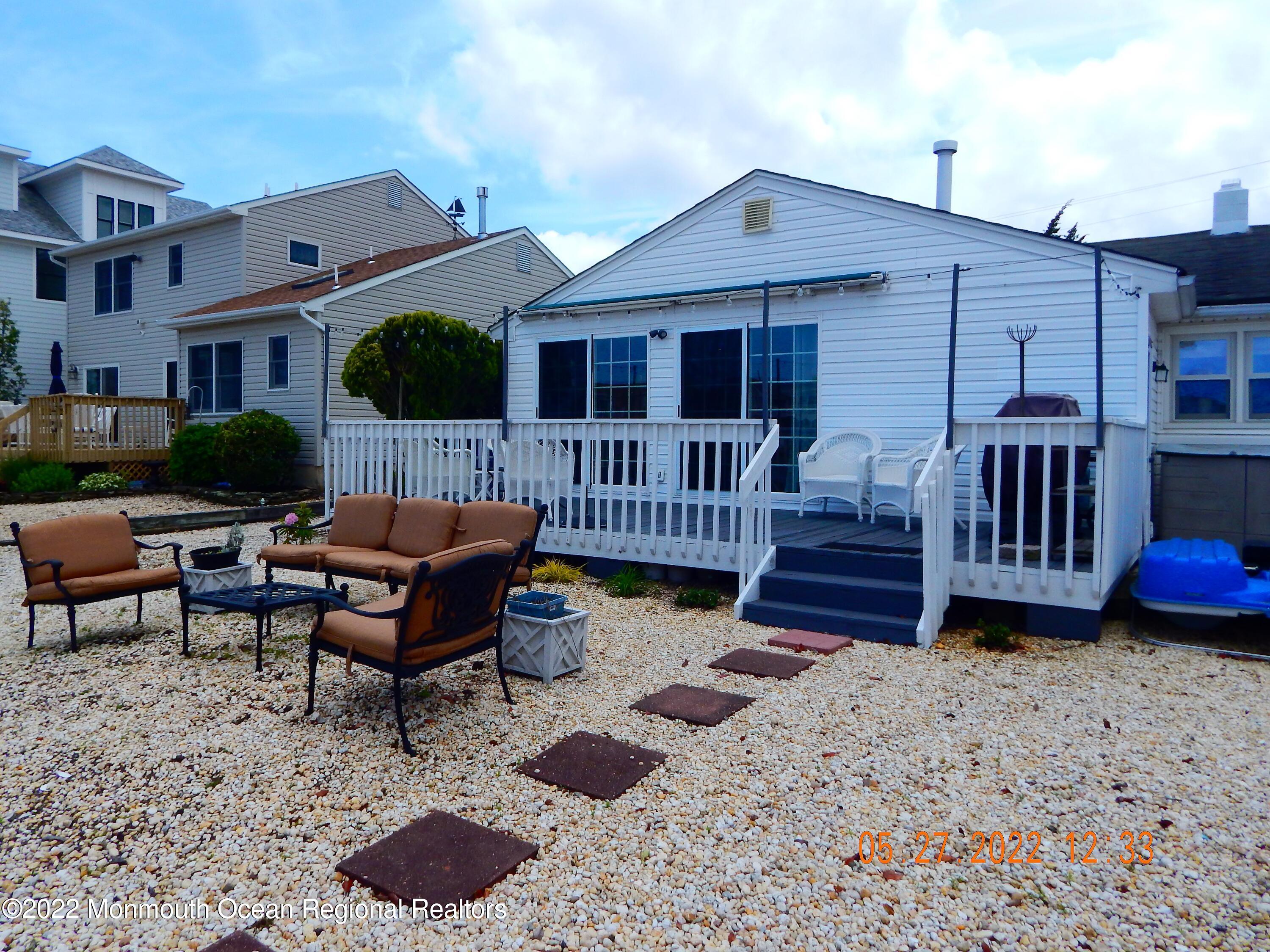 27 Club House Road Brick, NJ 08723 - Photo 24 of 31 a view of a house with backyard and sitting area