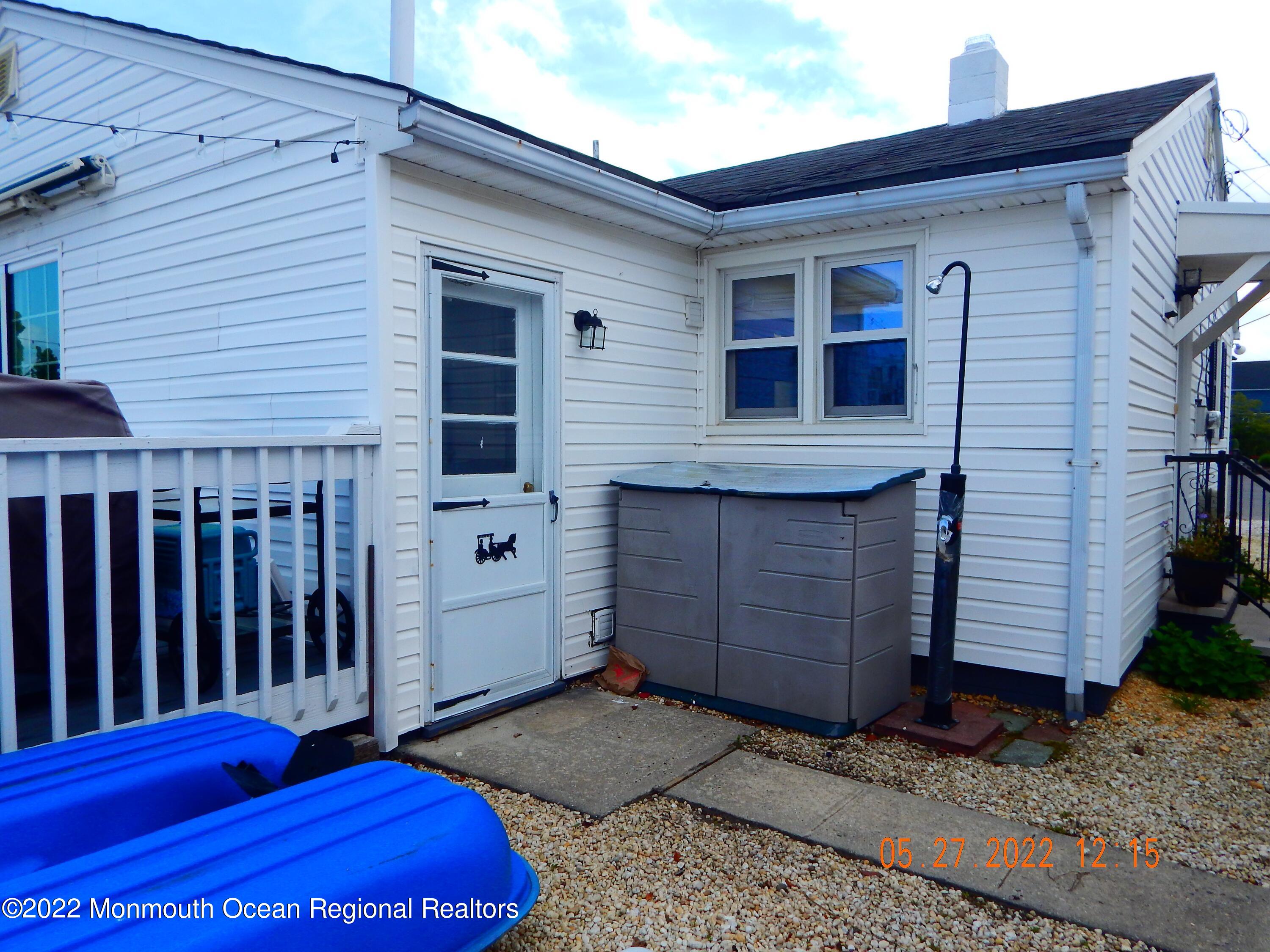 27 Club House Road Brick, NJ 08723 - Photo 26 of 31 a view of a small house with wooden fence
