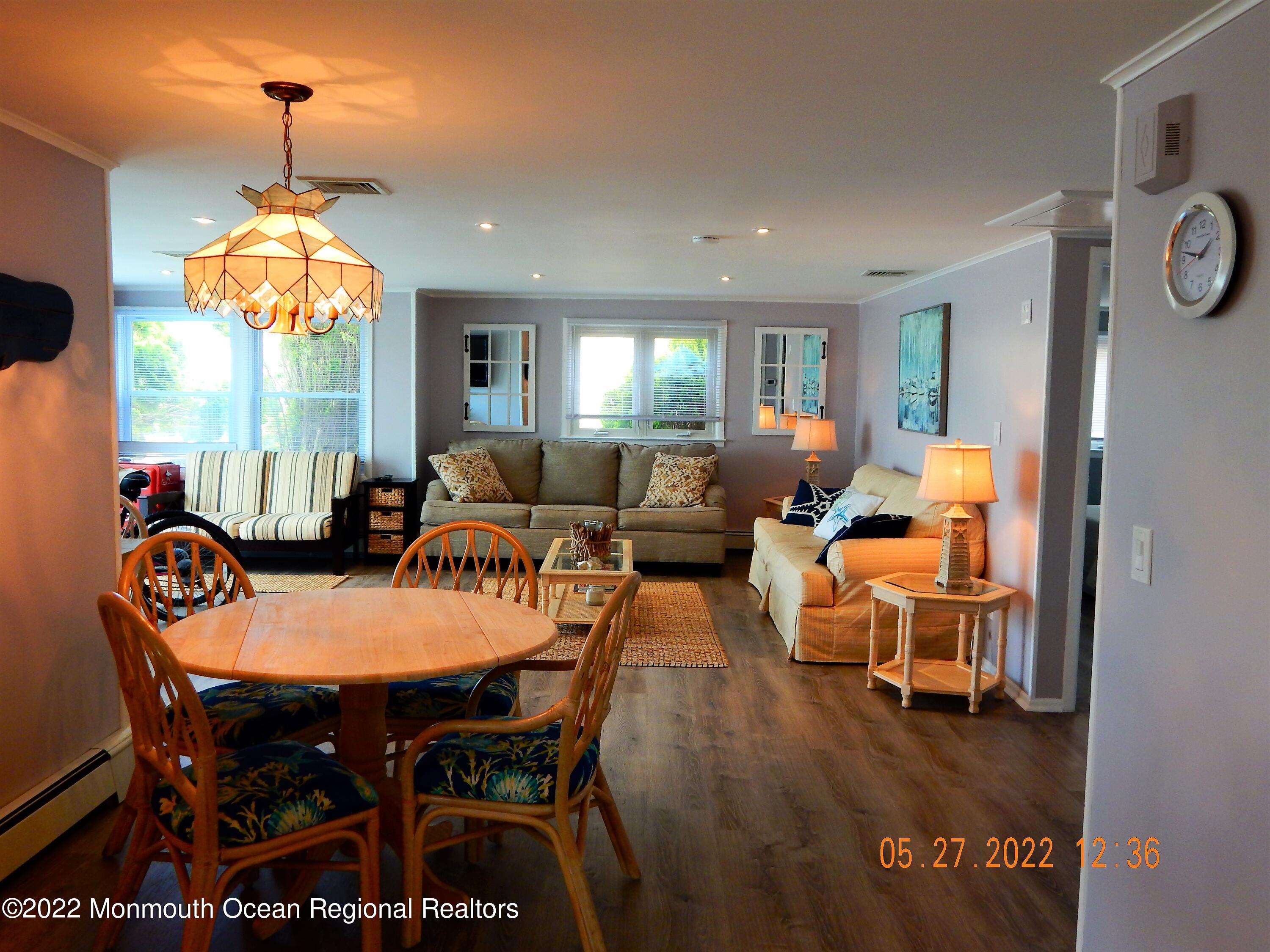 27 Club House Road Brick, NJ 08723 - Photo 7 of 31 a view of a dining room with furniture and chandelier