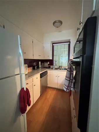 a bedroom with a bed chair and window